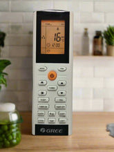 Air conditioner remote control with digital display on a white background
